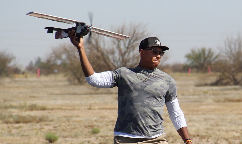 Aerospace engineer and incoming Pittsburgh Steelers quarterback Joshua Dobbs launches a model aircraft in the Design/Build/Fly American Institute of Aeronautics and Astronautics (AIAA) competition in Tucson, Arizona. Photo courtesy of AIAA.