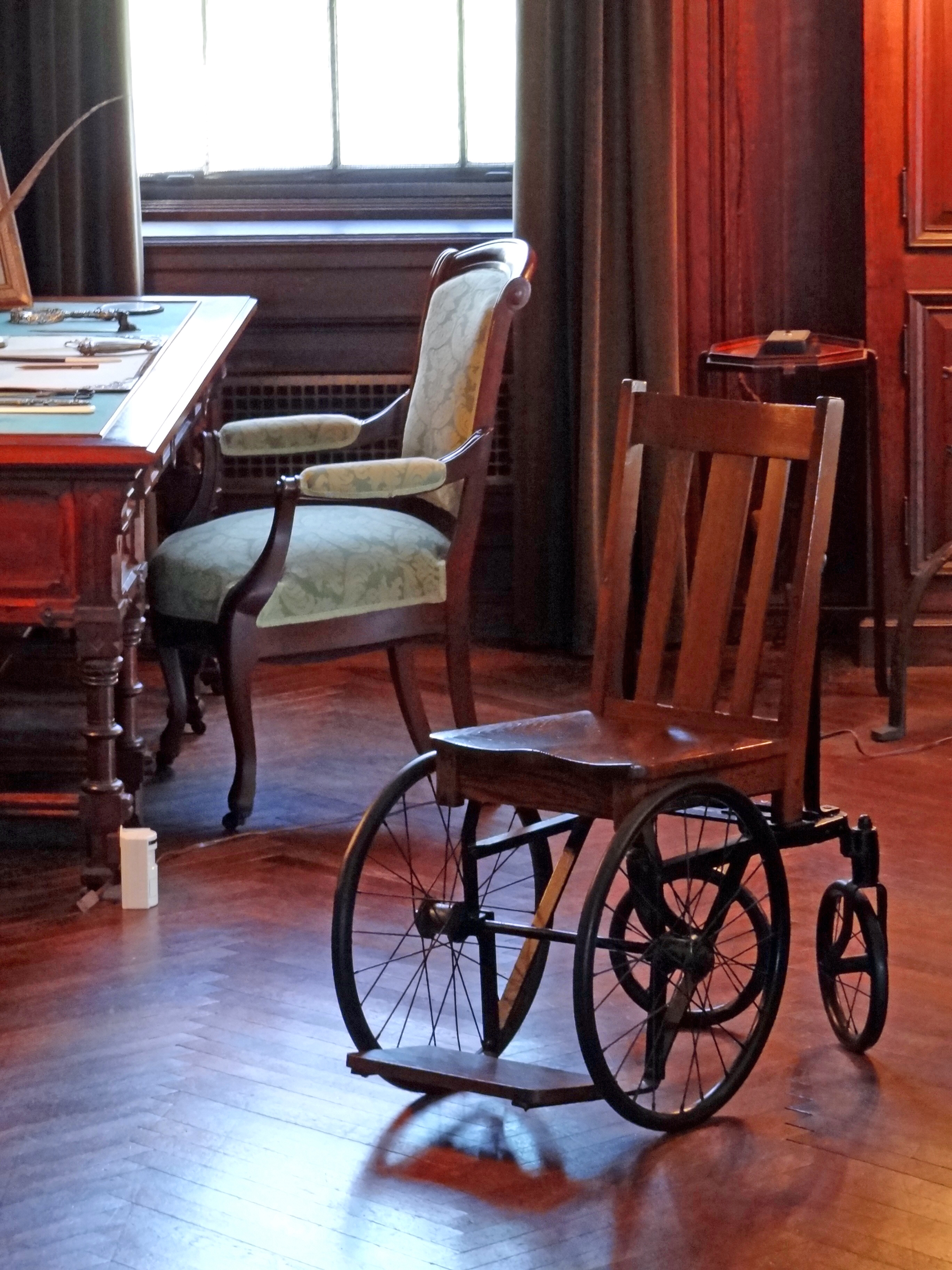  President Franklin Delano Roosevelt’s wheelchair stands beside the desk in his study at the Franklin D. Roosevelt Presidential Library & Museum in Hyde Park, New York. Photo by Adam Jones.