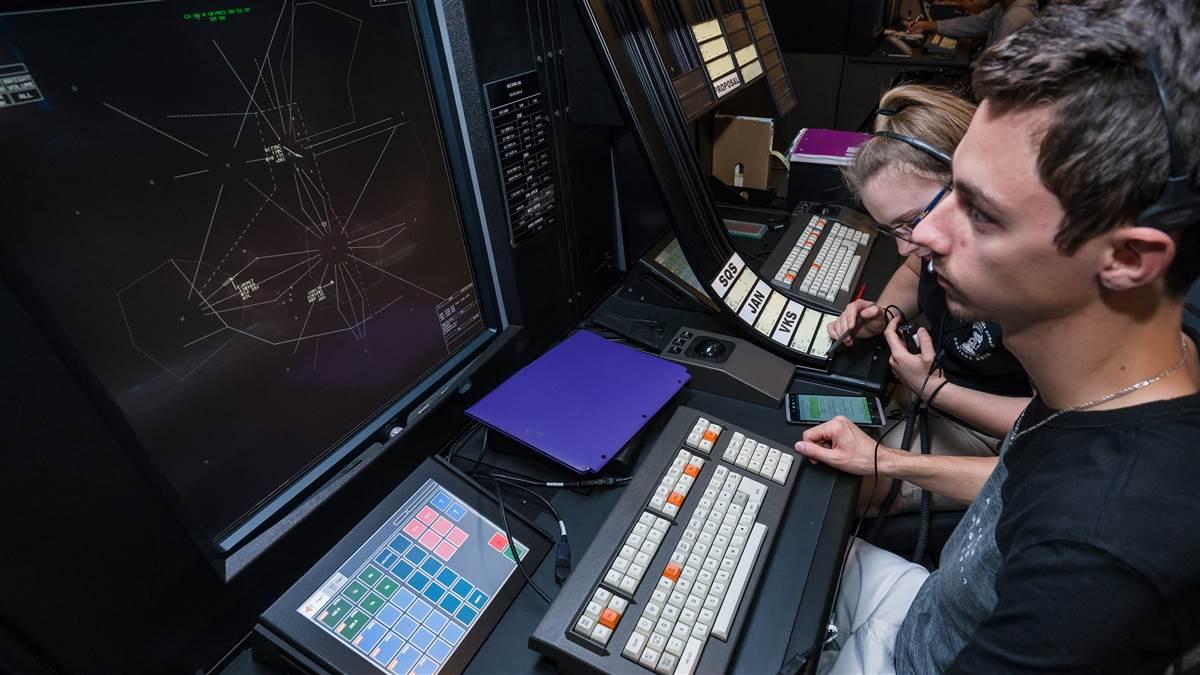 Embry-Riddle Aeronautical University students Jordan Harlow and Haley Dennis work on new air traffic control equipment in the en route lab on the Daytona Beach campus. Photo courtesy of Daryl LaBello, Embry-Riddle Aeronautical University.