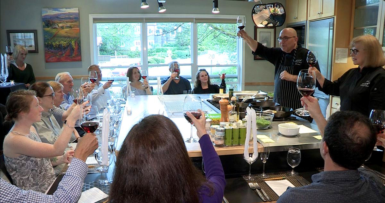 At EVOO, you’ll enjoy lively discussions and good wine as classically-trained chefs prepare a multi-course meal for you and your companions. Photo courtesy EVOO.