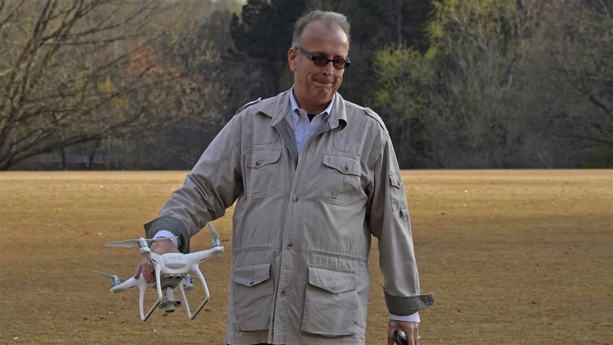 Drone Journalism School seminar director Al Tompkins prepares to fly a DJI Phantom drone during a hands on demonstration for participants. Photo by David Tulis.                                                                                                                                               