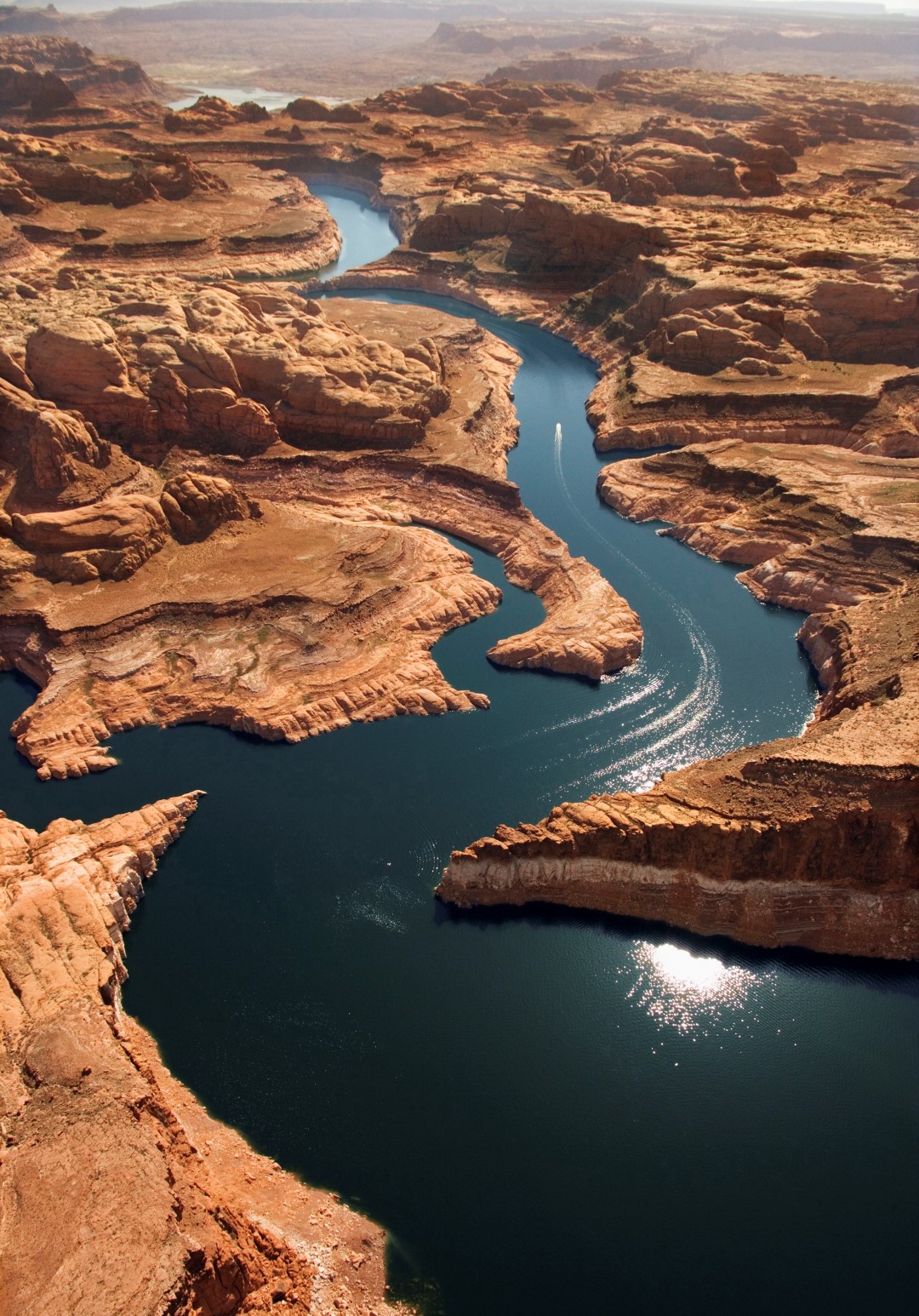 Lake Powell, the reservoir that fills Glen Canyon, is a long, sinuous waterway surrounded by Navajo Sandstone. Photo courtesy Kane County Tourism.