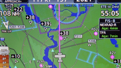 A panel-mounted navigation unit displays a line of aircraft returning to Daytona Beach's Embry-Riddle Aeronautical University after Hurricane Irma Sept. 13. Photo by David Tulis.