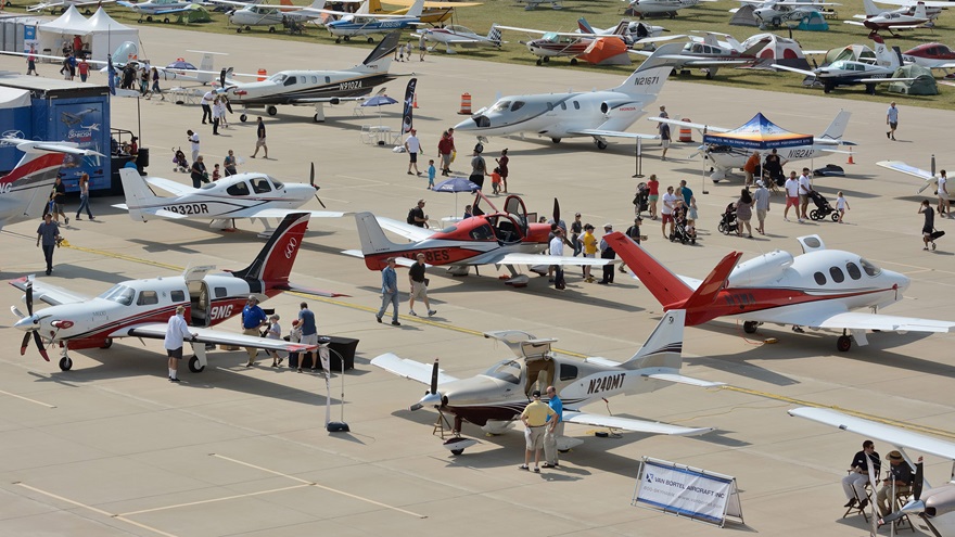 Visitors to AOPA's 2017 Norman Fly-In inspect some of the many display aircraft on hand for the event. Photo by Mike Collins.