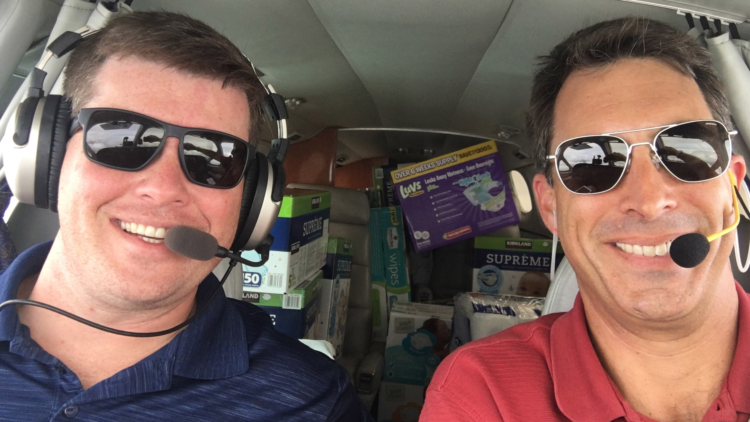 Brian Kelly (left) and Robert Johnson fly the first Operation Airdrop supply mission, Aug. 30. Photo courtesy of Robert Johnson.