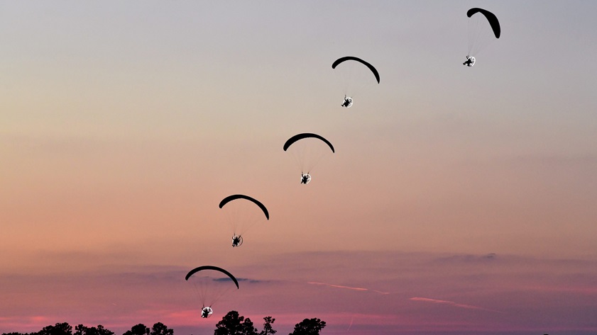 The Paradigm Team's powered paragliders perform at Sun 'n Fun 2018. Photo by Mike Collins.