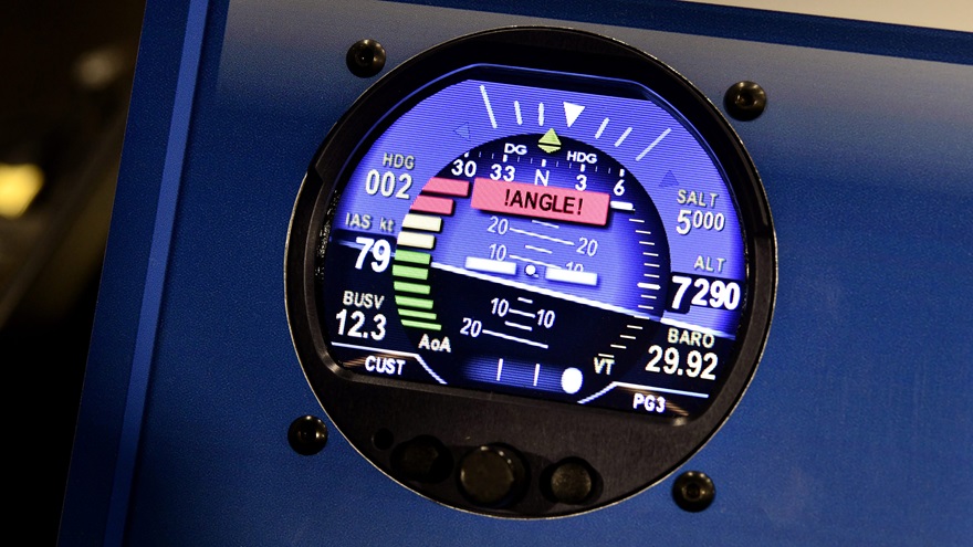 AeroVonics displayed its AV-30, a digital dual-mode attitude and direction indicator, at EAA AirVenture 2018. This one is shown in a vintage attitude indicator theme, designed for visual compatibility with classic aircraft where it could replace legacy gyro instruments. Photo by Mike Collins.