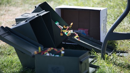 Military surplus ammunition cans are used to store potentially volatile lithium polymer batteries. Photo by Jim Moore.