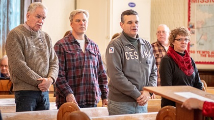 Pat Marra, second from right, attends a church service for pilots participating in the Holly Run. Marra has been traveling to Tangier and volunteering his time for the past five years. Photo courtesy of Remsberg.com.