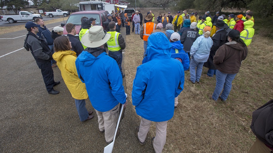 Search and rescue teams hold a debrief following a Feb. 3 exercise. The Parrot Disco deployed during the exercise (among other unmanned systems) is held by one of the CRASAR pilots (who are wearing royal blue jackets) at center. Jim Moore photo. 