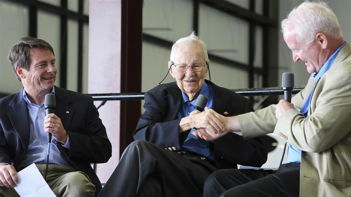 AOPA charter member Earle Blomeyer gets a handshake from AOPA President and CEO Mark Baker during a commemoration of the association’s seventy-fifth anniversary in 2014 as AOPA Editor in Chief Tom Haines looks on. AOPA file photo. 
