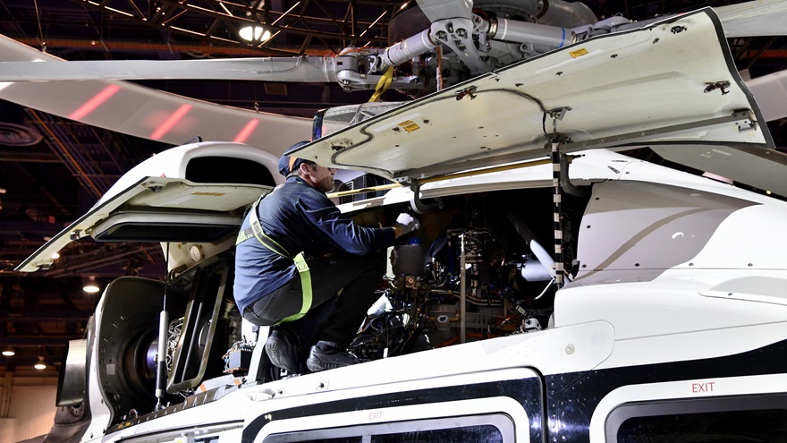 An Airbus Helicopters technician demonstrates how easily maintenance can be performed on the company's new H160. Demonstrations were conducted daily at HAI Heli-Expo 2018. Photo by Mike Collins.