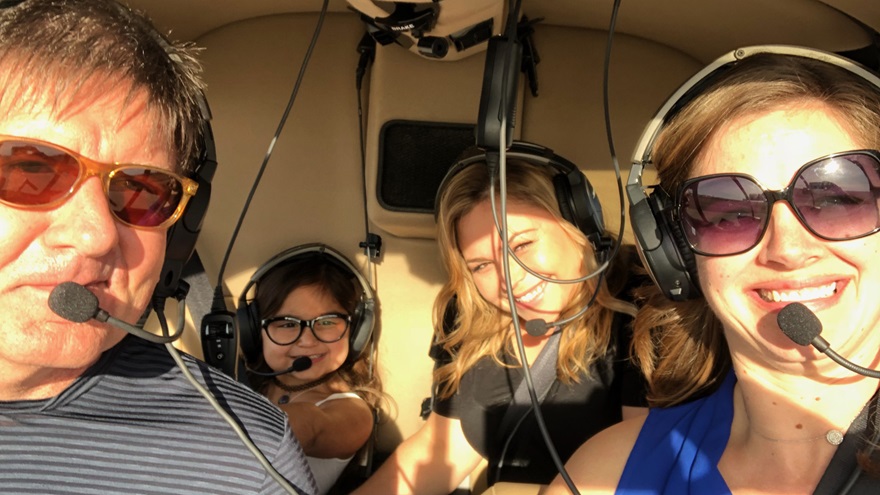 From left, helicopter pilot John Ross flew Eliana Georges and her mother, Samantha McVee, to Children's Hospital Los Angeles, with volunteer airlift organizer Emily Barany along for the ride. Photo courtesy of Emily Barany. 