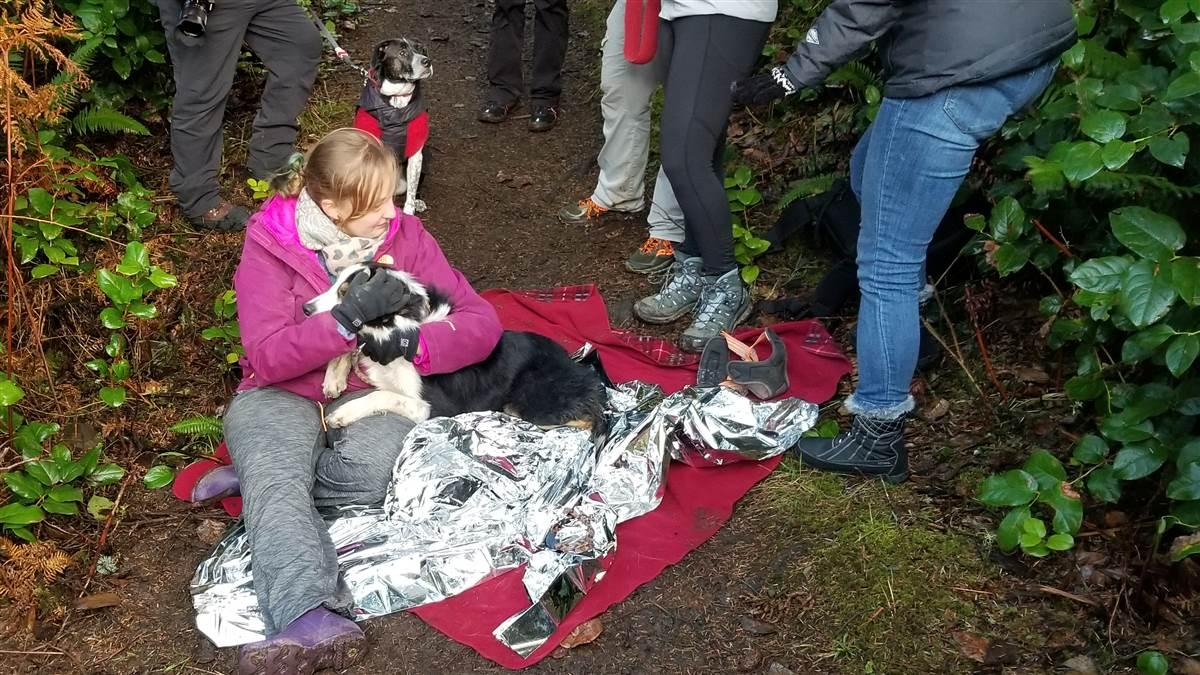 Sarah Stremming is reunited with her beloved border collie after a successful rescue Dec. 26. Photo courtesy of Matthew Verley. 