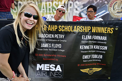 Alpha Eta Rho aviation fraternity national president Toni Mensching announces five 2018 scholarship winners during EAA AirVenture in Oshkosh, Wisconsin, July 25, 2018. Photo by David Tulis.