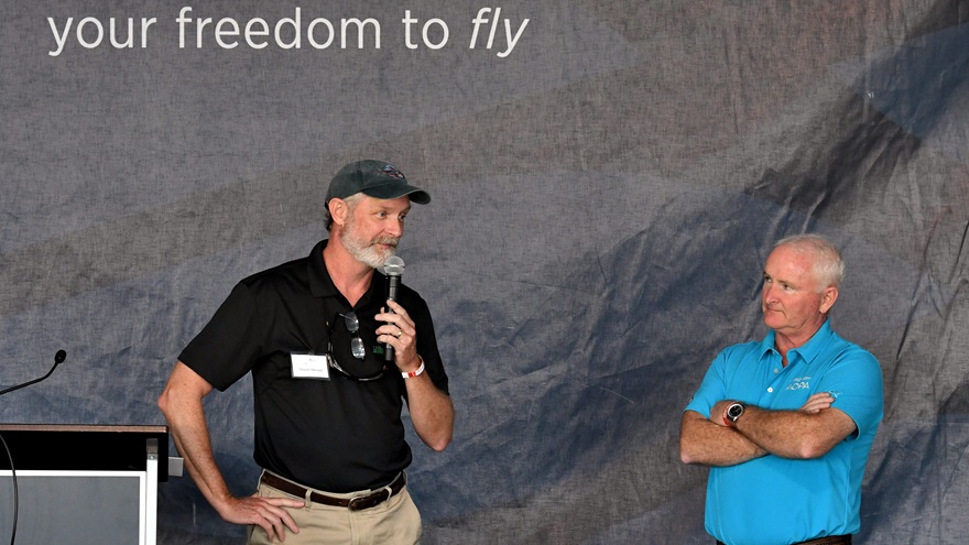Chuck Ahearn, chairman of the Ray Foundation, left, speaks after AOPA President Mark Baker, right, announced that 3,800 donors contributed more than $1.8 millon to the 2018 You Can Fly Challenge. The Ray Foundation incresed its matching grant from $1.4 million to $1.8 million. Photo by Mike Collins.
