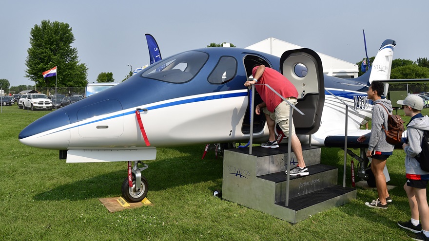 Attendees get a closer look at the Stratos 714 twin jet during EAA AirVenture at Wittman Regional Airport in Oshkosh, Wisconsin, July 23, 2018. Photo by David Tulis.