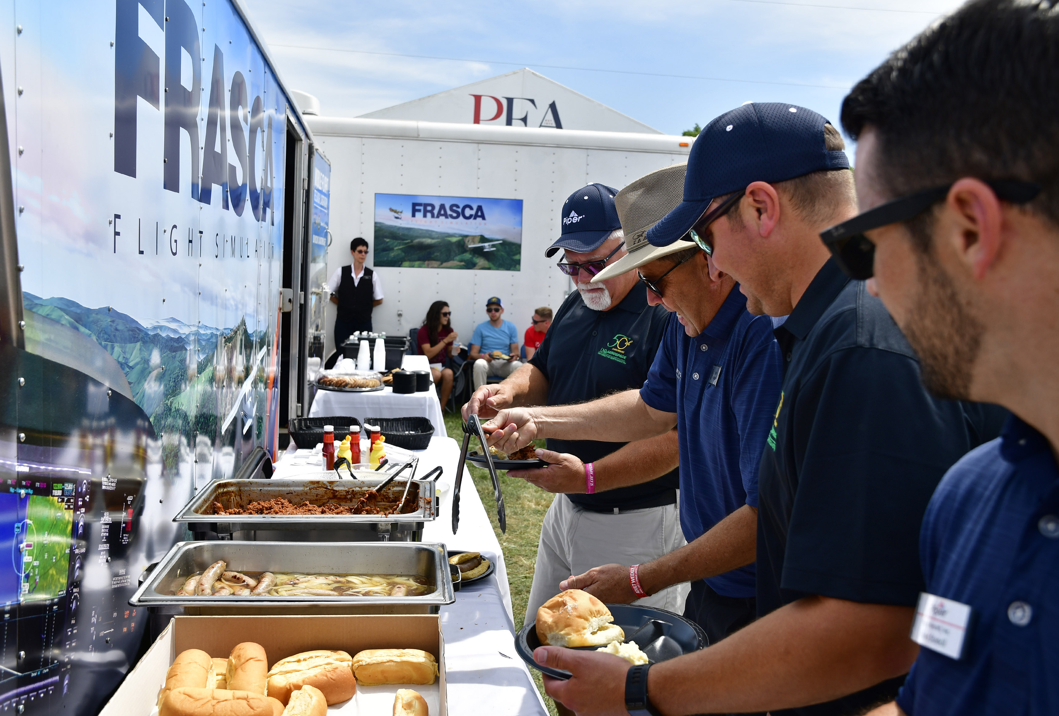 Frasca Flight Simulation celebrates the flight training device maker's sixtieth anniversary with a luncheon for colleges, instructors, and guests during EAA AirVenture in Oshkosh, Wisconsin, July 25. Photo by David Tulis.