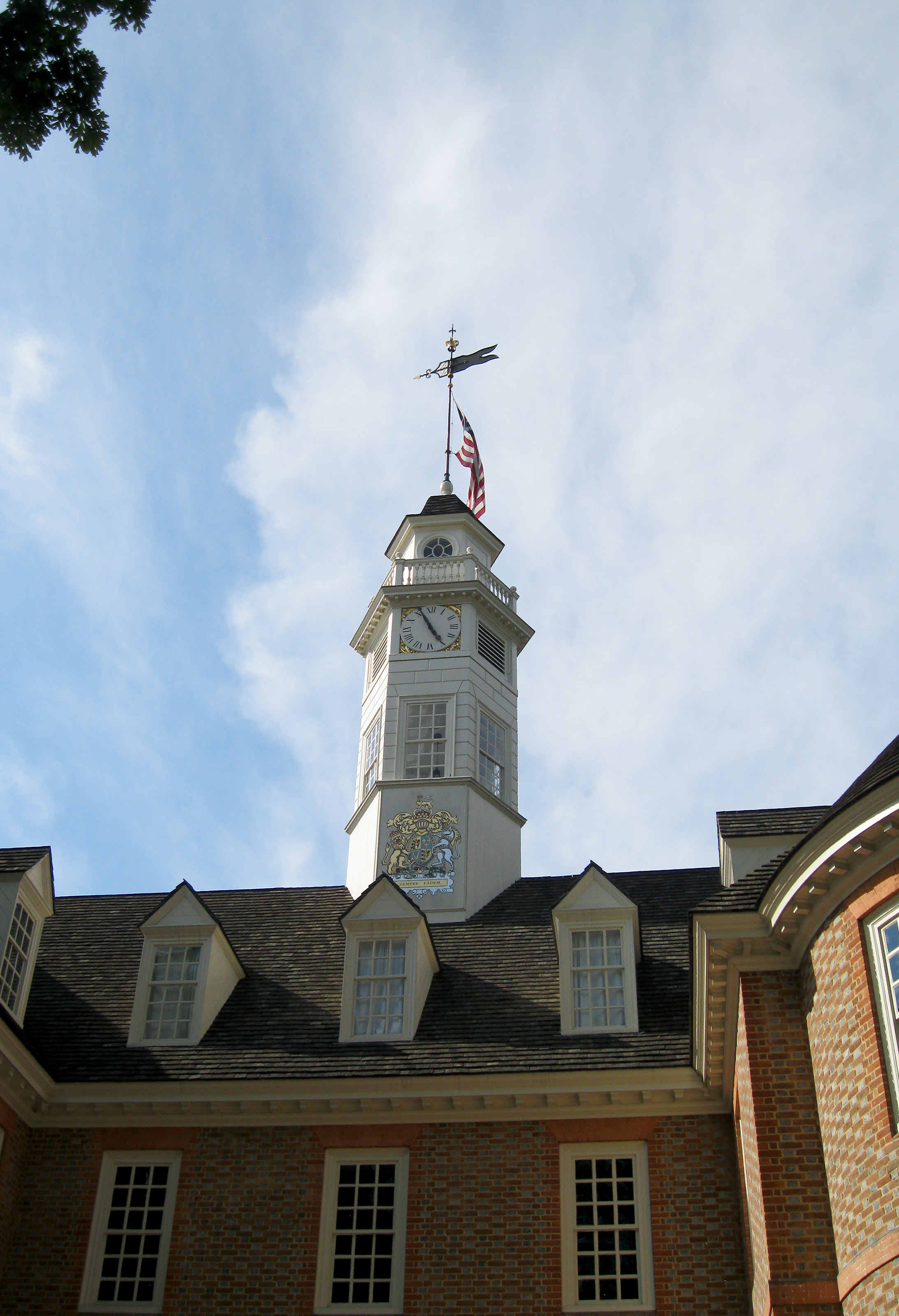 A U.S. flag waves proudly in the breeze above the Capitol in Colonial Williamsburg. The state government occasionally meets in the building to keep it designated as an active Capitol. Groups can tour the building or take part in mock witch trials. Photo by Alyssa Cobb.                               