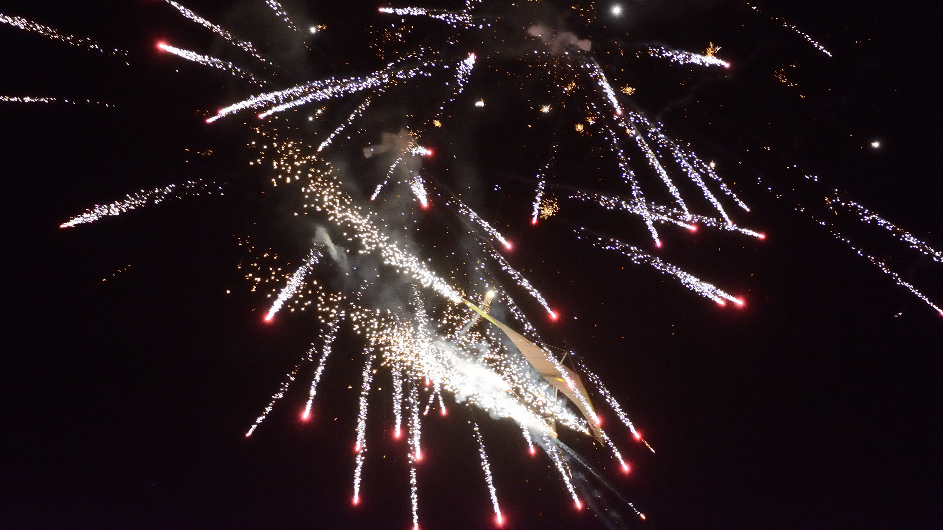 Fireworks almost obscure Dan Buchanan's ultralight aircraft during his night performance during the 2016 Sun 'n Fun Fly-In and Expo. Photo by Mike Collins.