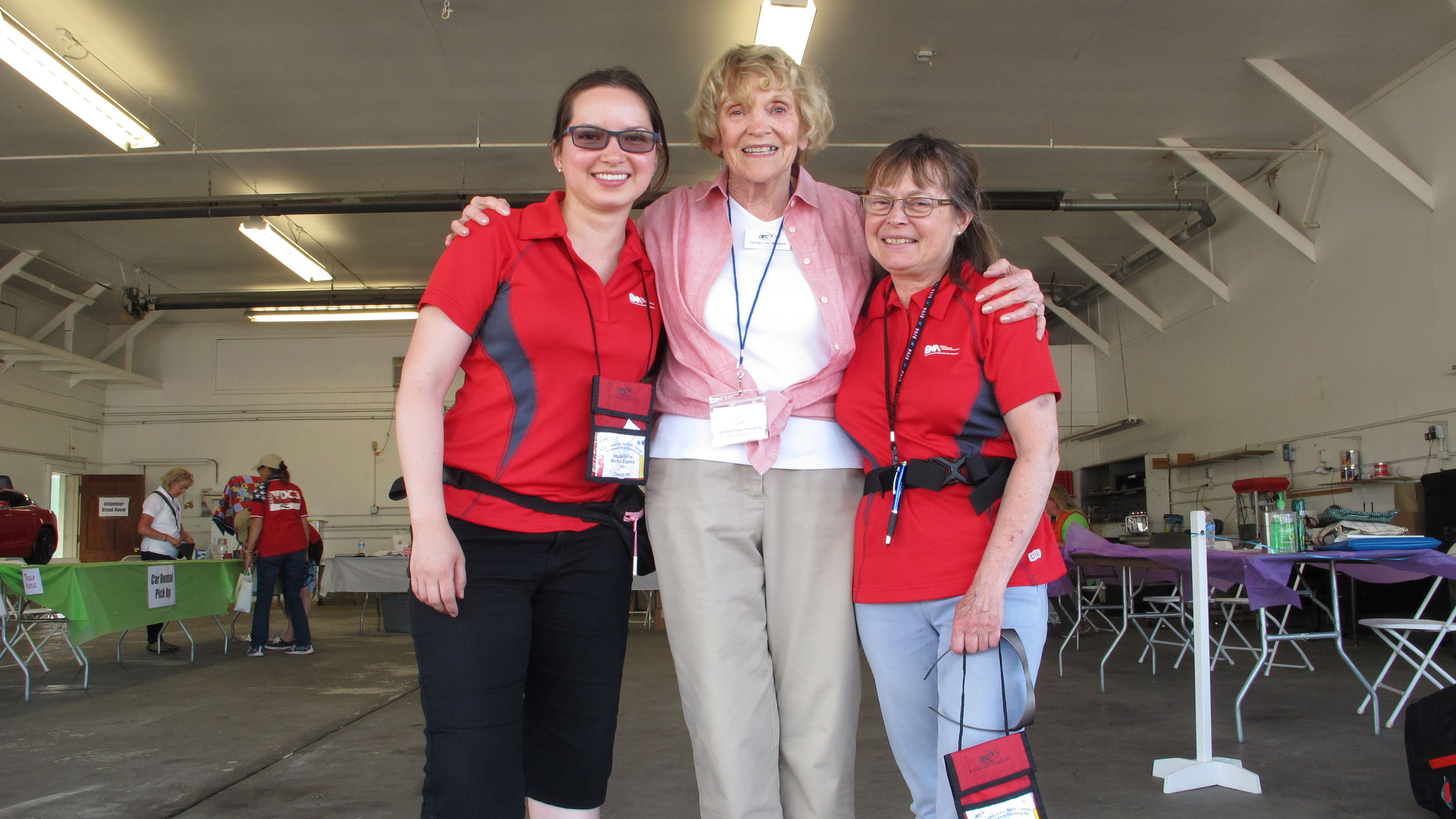 Madeleine Mena Zapata (left) and Michèle Rivest (right) of École Nationale d'Aérotechnique are welcomed to Fryeburg, Maine, by Air Race Classic Race Director Carolyn Van Newkirk. The Canadian team flew to a twelfth-place finish. Photo by Dan Namowitz.