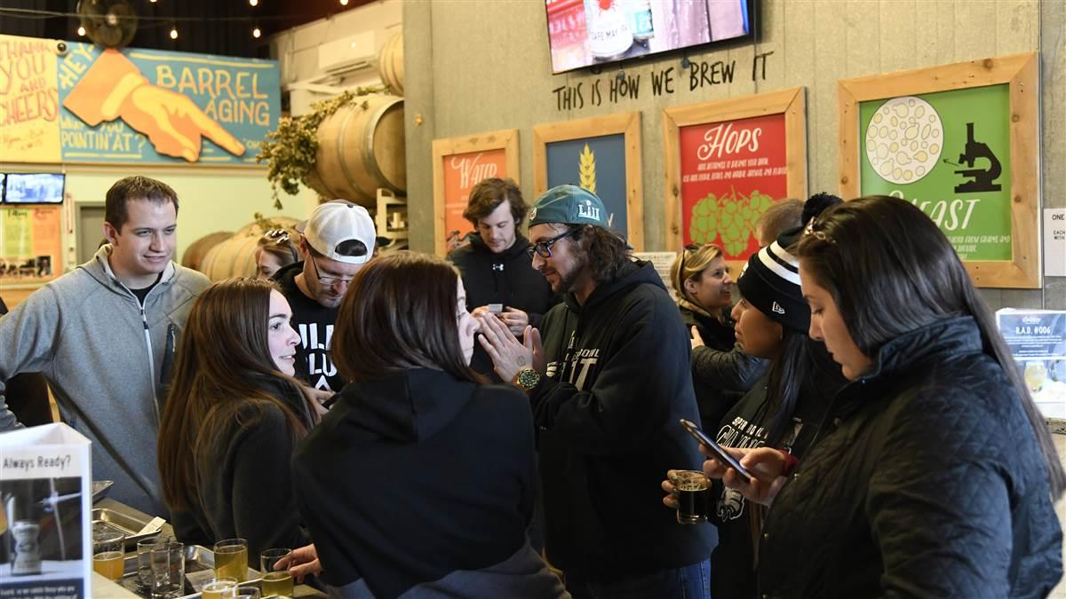 Patrons gather at the Cape May Brewing Co., at Cape May County Airport in New Jersey. Photo by David Tulis.                                                                                                                                                                                  