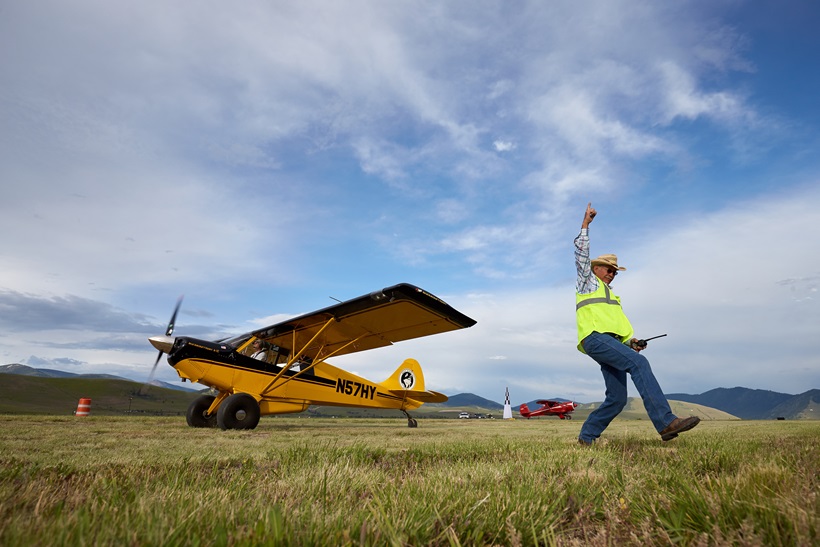 Aircraft wrangler Jimmy Gist orchestrates a short takeoff and landing demonstration with an Aviat Husky during an AOPA Fly-In. This year, AOPA Fly-Ins will feature a STOL Invitational during its Flightline Cookouts on Friday evenings! Photo by Mike Fizer.