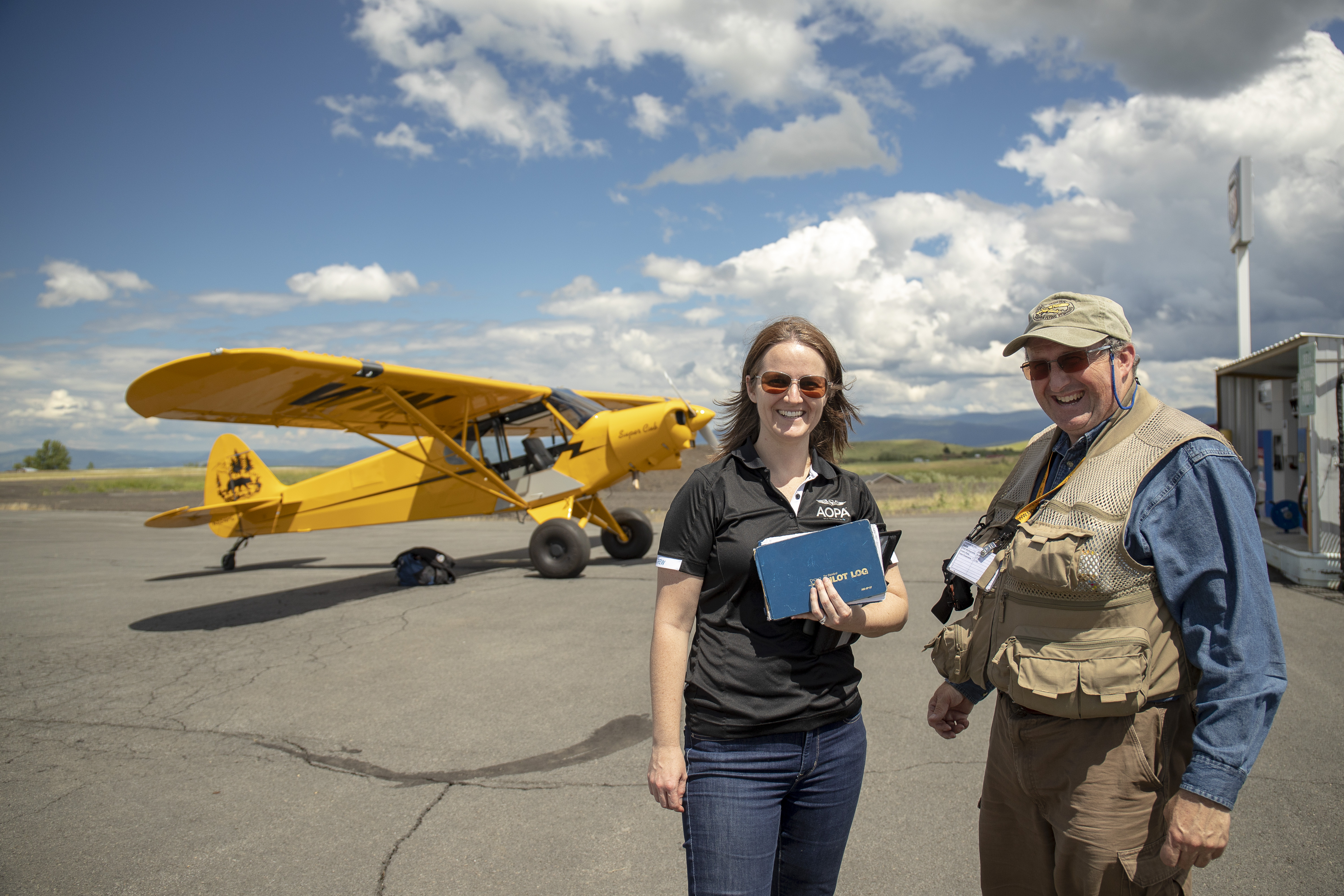AOPA's Alyssa Cobb receives instruction from McCall Mountain Canyon Flying's Gary Glodowski in the Sweepstakes Super Cub at Slate Creek Strip in Idaho. Photo by Mike Fizer.