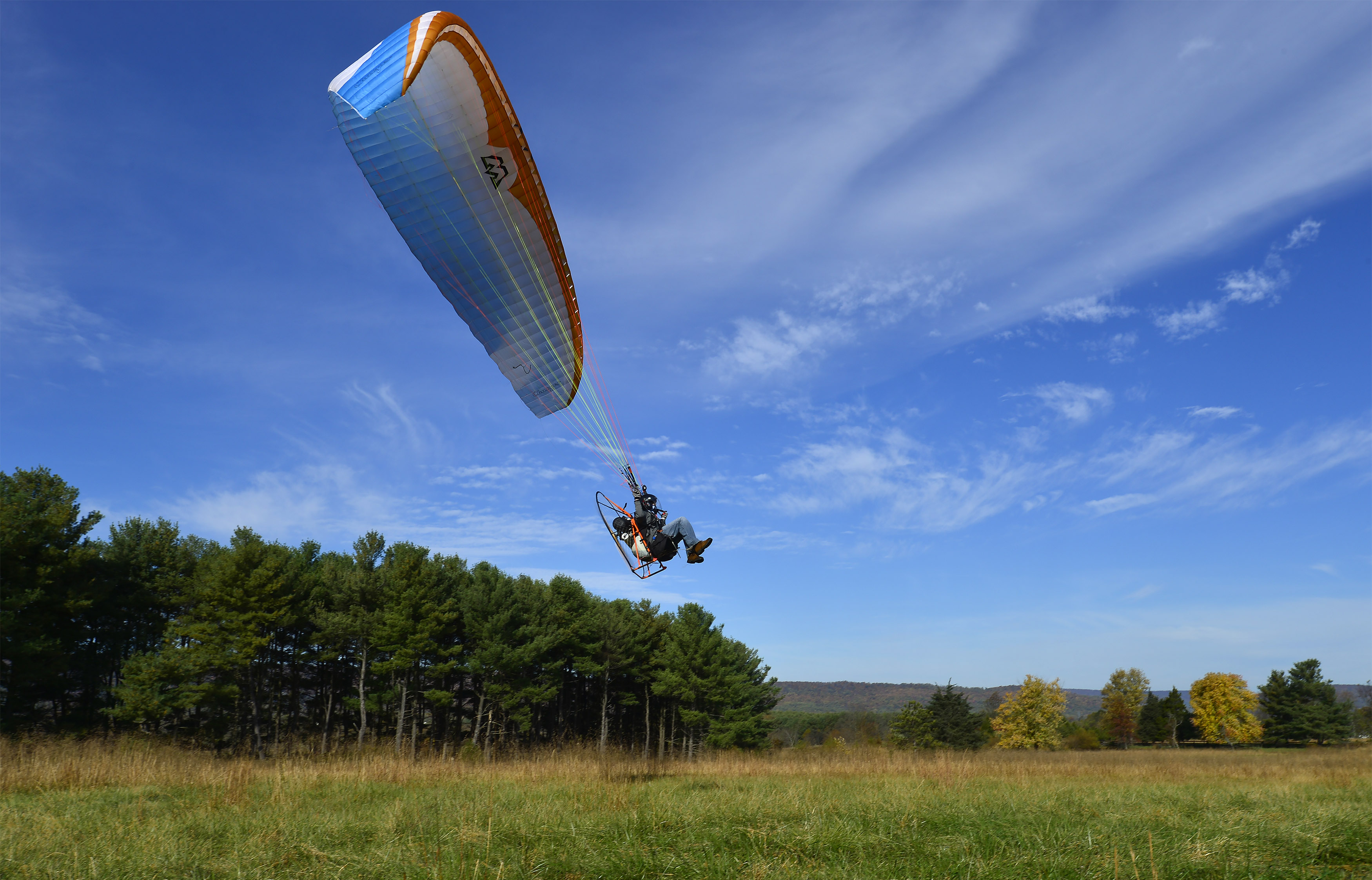 Powered paraglider pilot Henry Scott lifts off in Lovettsville, Virginia. Photo by David Tulis.
