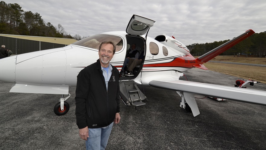 Jay Jolley beside his new Cirrus SF50 Vision Jet. Photo by Tom Snow.