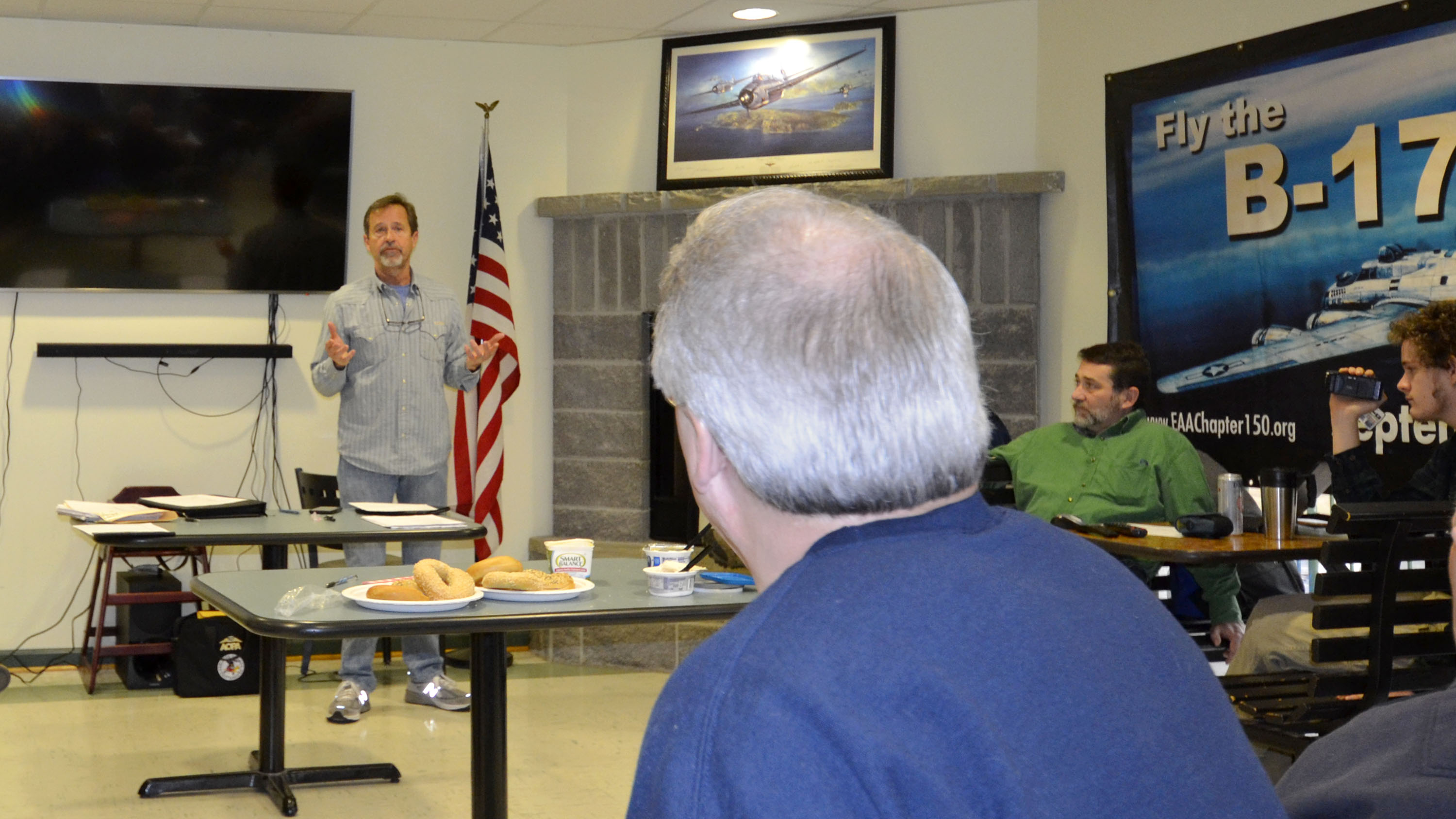 Jay Jolley speaks about his journey to becoming a jet pilot during EAA Chapter 150's monthly meeting. Photo by Tom Snow.