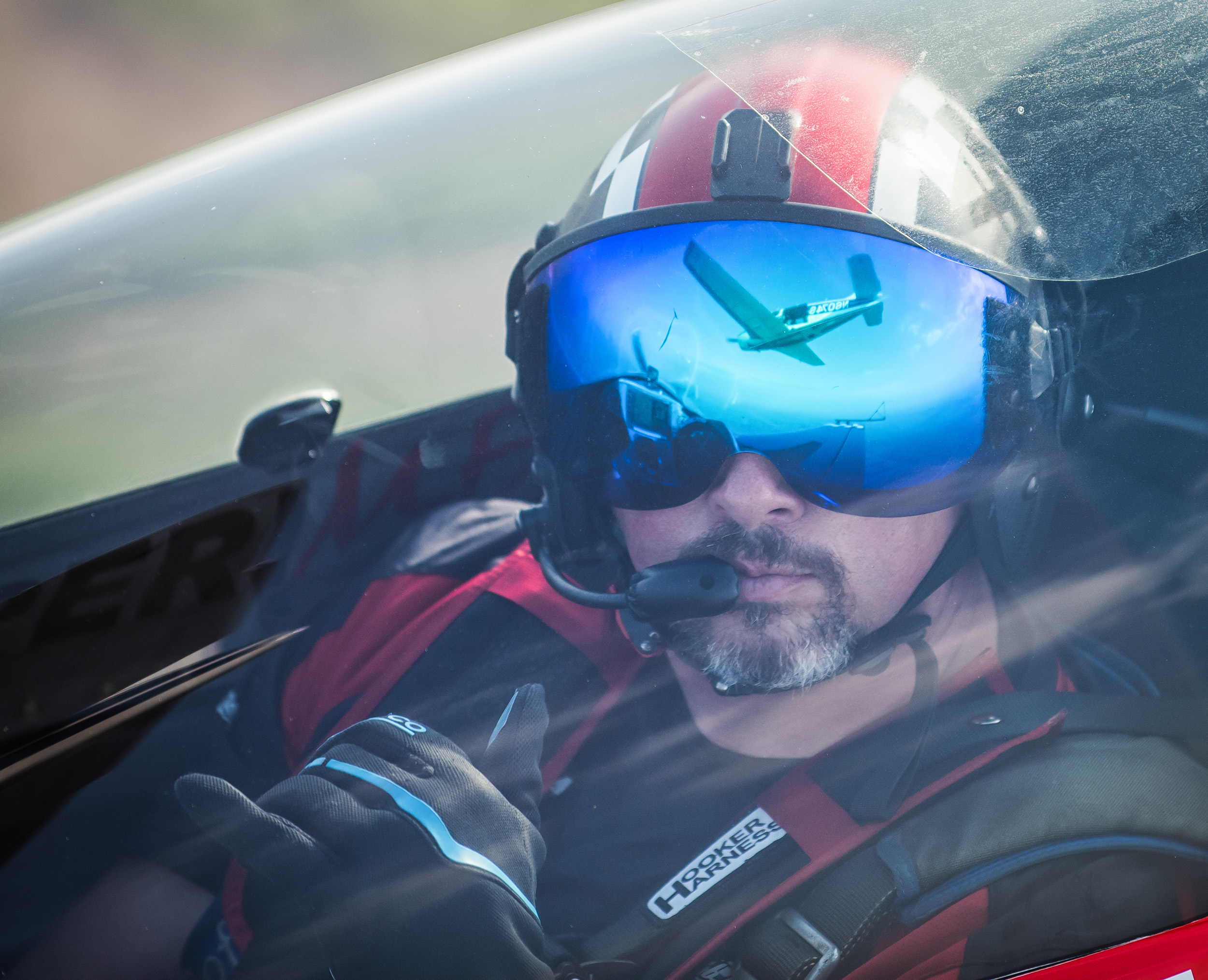 Rob Holland had high praise for Hooker Harness and Bonehead Composites, makers of his safety harness and helmet, along with MX Aircraft, for producing the equipment that protected him from harm during a March 25 forced landing. Photo by Glenn Watson-Mach Point One Aviation Photography.