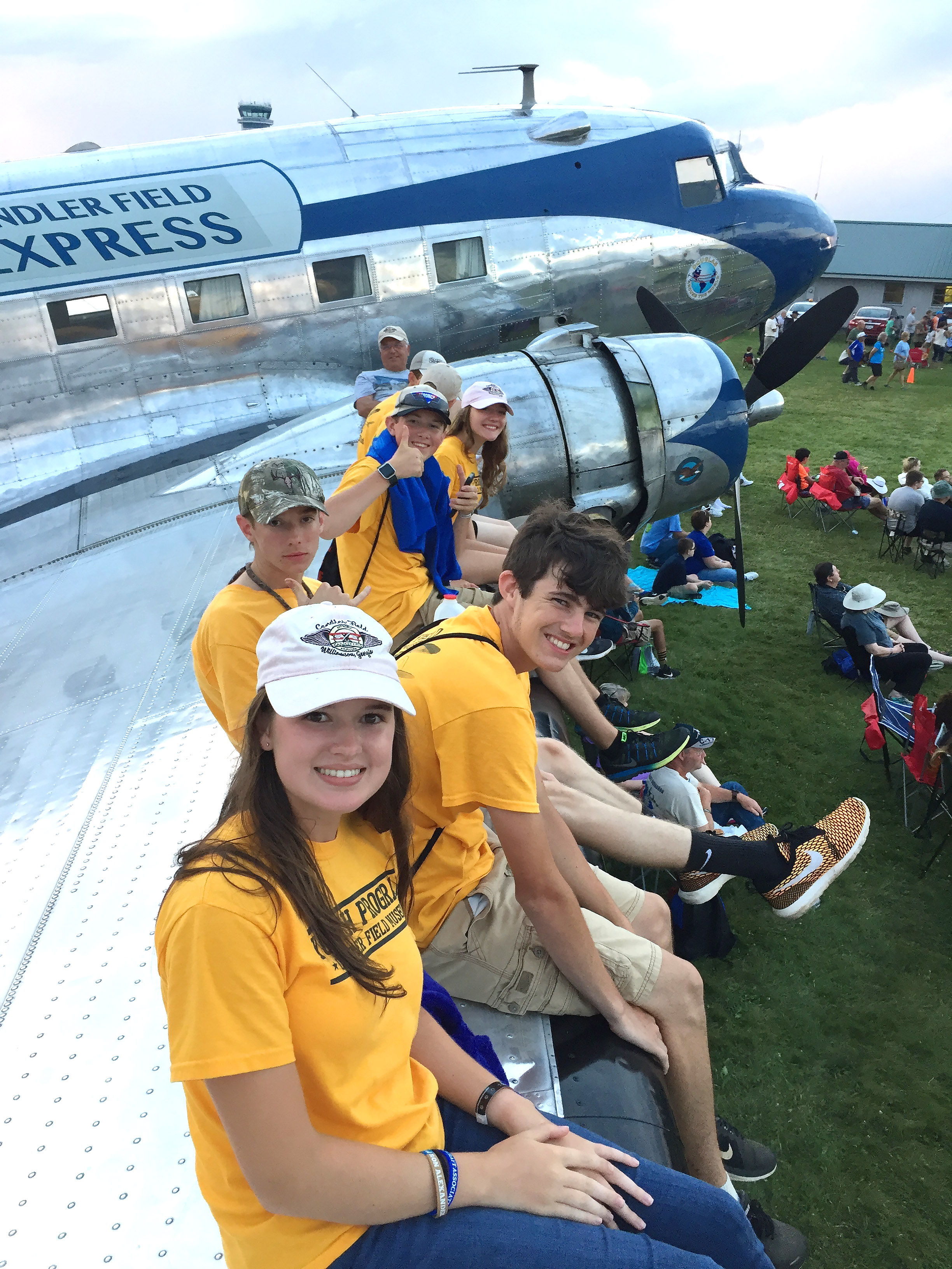 Cayla McLeod (front) learned to fly at Peach State Aerodrome in Williamson, Georgia, with instructor and mentor Ron Alexander, who founded the Candler Field Museum aviation youth mentorship program. Her first flight was in the Douglas DC-3 pictured here. Photo courtesy of Cayla McLeod.