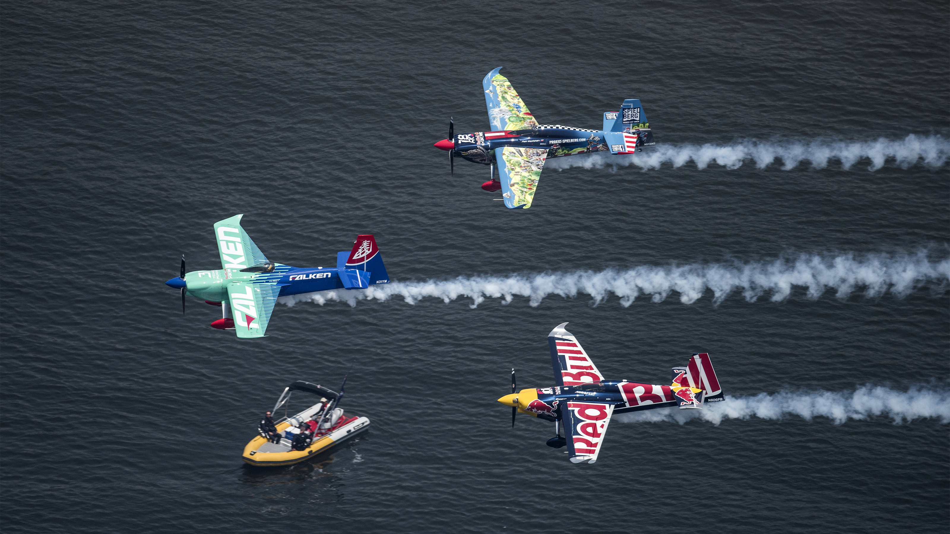 Defending champion Yoshihide Muroya of Japan leads a formation flight with Czech Republic pilots Petr Kopfstein and Martin Sonka during the Pilots Parade prior to the finals at the third round of the Red Bull Air Race World Championship in Chiba, Japan on May 27, 2018. // Joerg Mitter / Red Bull Content Pool