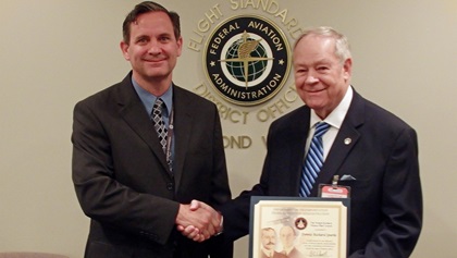 FAA Manager Jeff Slaughter presents Dennis Sparks (right) with the FAA Wright Brothers Master Pilot Award. Photo courtesy of Dennis Sparks.