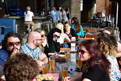 Local residents fill the Hunter-Gatherer Brewery inside the restored Curtiss-Wright Hangar at Jim Hamilton-L.B. Owens Airport near downtown Columbia, South Carolina. Photo by David Tulis.