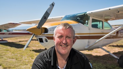 Ted Malone, the 5,000th pilot to get back in the air through AOPA's Rusty Pilots program, flew himself and his wife, Mary, from Scottsdale, Arizona, to AOPA's 2018 Santa Fe, New Mexico, Fly-In in the Cessna 182 shown behind him. Photo by Mike Collins.