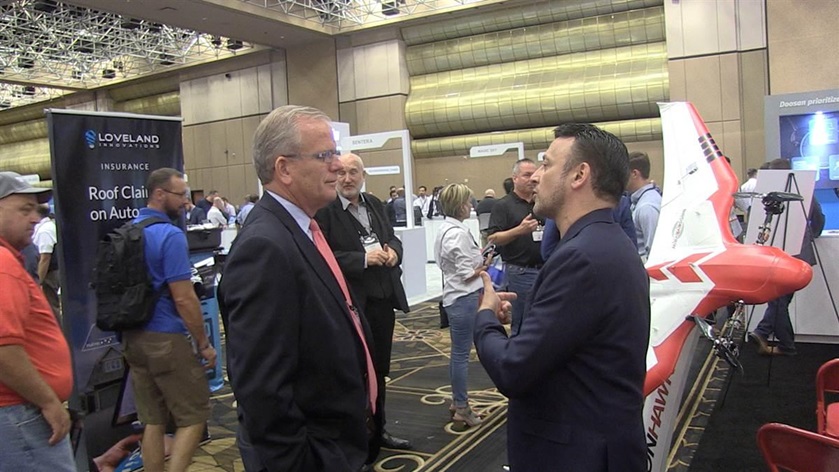 PrecisionHawk CEO Michael Chasen, right, chats with acting FAA Administrator Daniel Elwell, center, at the InterDrone conference in Las Vegas. Jim Moore photo. 