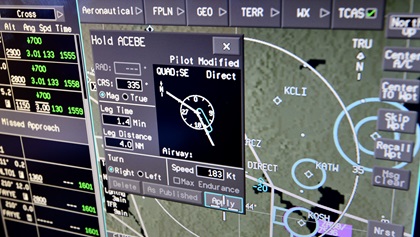 BendixKing's new touchscreen AeroVue flight deck allows the pilot to quickly and easily set up published holds, and modify any assigned hold. Photo by Mike Collins.