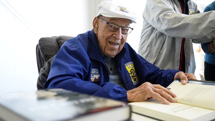 Retired Lt. Col. Dick Cole, pictured here at 100 years old, signed copies of his book and talked with guests during an event at the AOPA National Aviation Community Center in Frederick, Maryland, in 2015. Photo by David Tulis.