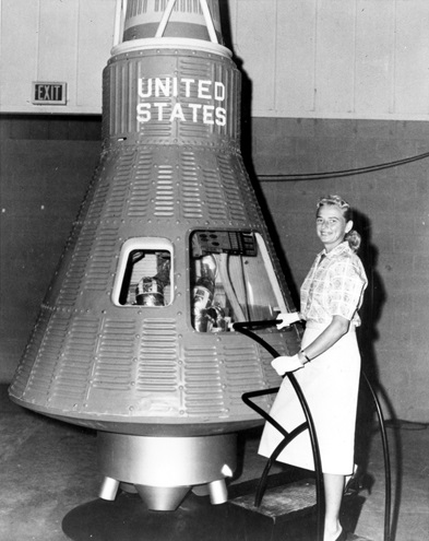 Jerrie Cobb poses next to a Mercury spaceship capsule. Although she never flew in space, Cobb and other members of the First Lady Astronaut Trainees underwent physical tests similar to those taken by the Mercury astronauts. Photo courtesy of NASA.