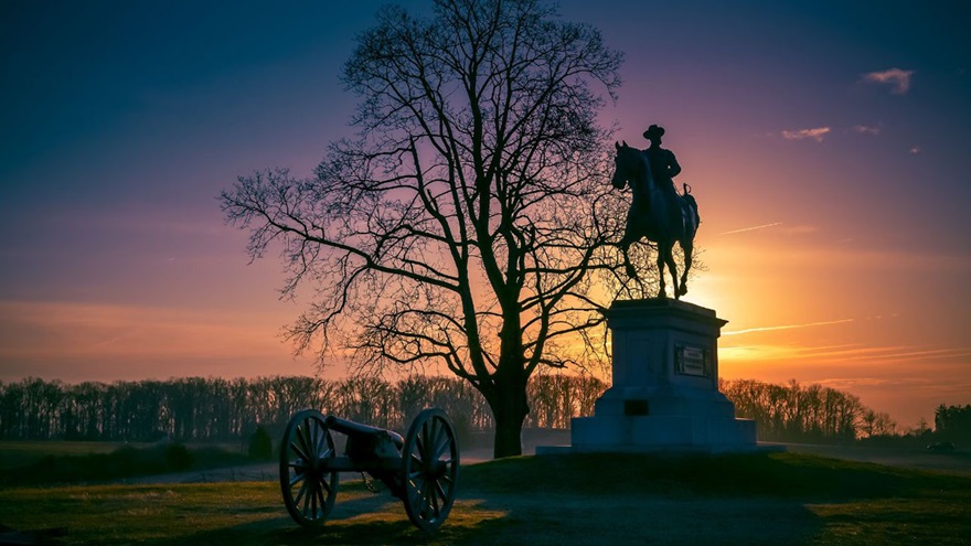 Sunset at Gettysburg National Military Park silhouettes the John F. Reynolds equestrian statue. Photo courtesy of Destination Gettysburg.