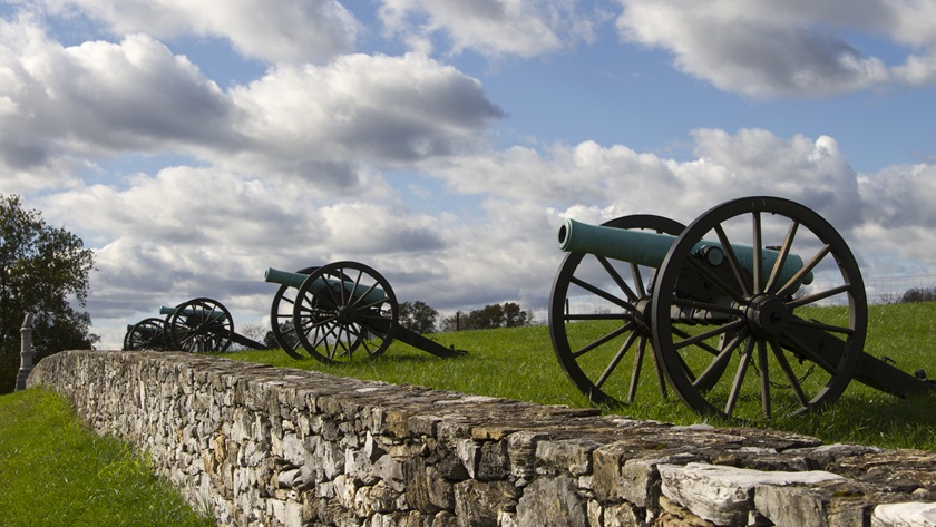 Civil War cannons line a stone wall at Antietam National Battlefield. Photo courtesy of the National Park Service.