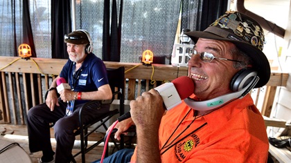 Sun 'n Fun Radio Chairman Dave Shallbetter, right, and longtime announcer Dave Higdon conduct a signature "chat from the porch" during the 2019 Sun 'n Fun International Fly-In and Expo, where the station celebrated 25 years of service. Photo by Mike Collins.