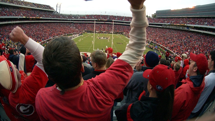 University of Georgia NCAA football fans cheer on the Bulldogs during the opening kickoff at Sanford Stadium in Athens, Georgia. Photo by David Tulis.