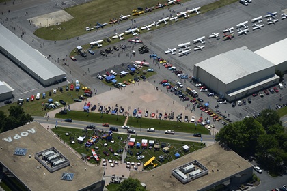 Aviation, automobile, and motorcycle aficionados mingled with historic aircraft, custom and classic autos, and unique motorcycles during the free Wings ‘n Wheels event at Frederick Municipal Airport near AOPA headquarters in Frederick, Maryland, June 10. Photo by David Tulis.