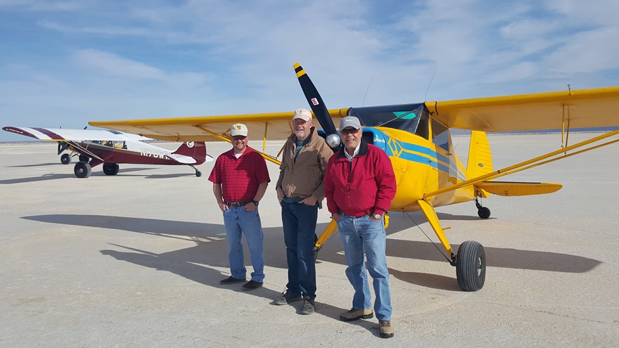 Luscombe co-owners (from left) Jerry Sheppard and Dennis Flosi stand in front of their airplane at Salt Flat, Texas, with friend Manny Estrada. Photo courtesy of Jim Ivey.