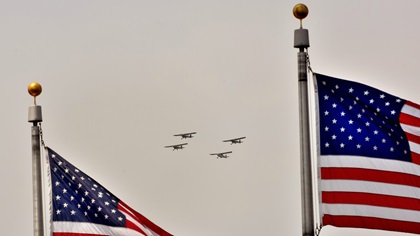 Four liasion aircraft fly in formation above the National Mall in Washington, D.C., during the Arsenal of Democracy: World War II Victory Capitol Flyover on May 8, 2015. Photo by Mike Collins.