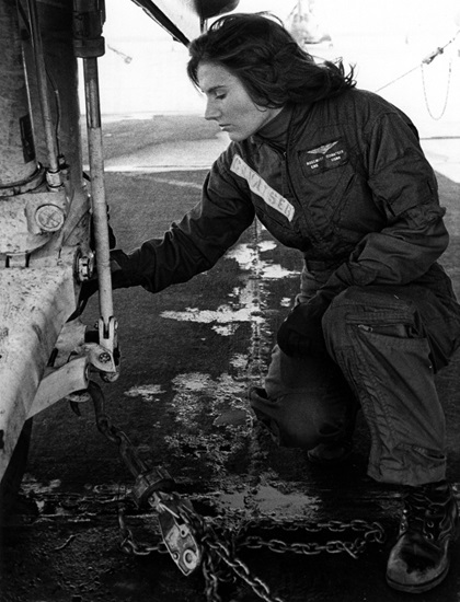 Rosemary Mariner making pre-flight checks of the main gear of a fleet composite squadron two, VC-2, S-2 tracker antisubmarine aircraft during her time as an ensign at Naval Air Station Oceana in Virginia Beach, Virginia. Photo courtesy of National Archives & Records Administration.