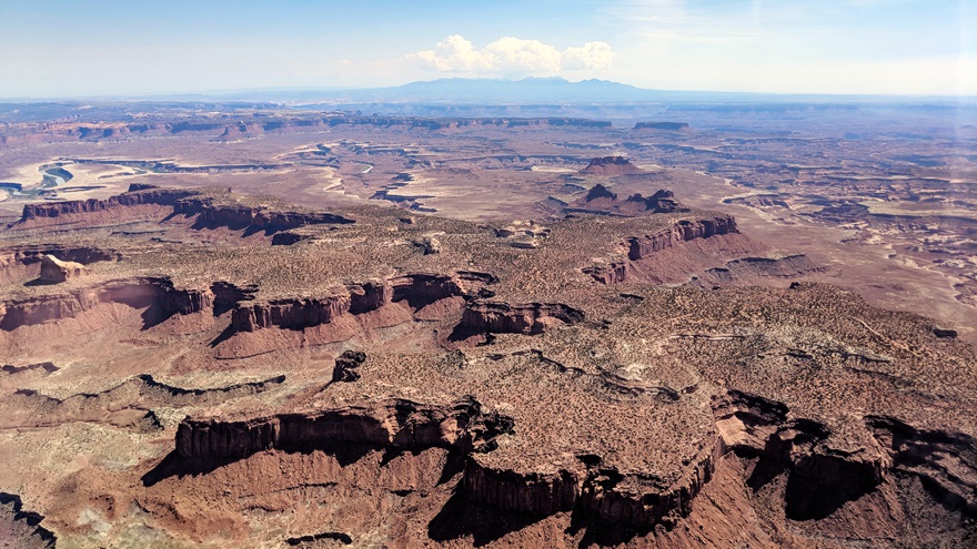 Desert trips in an airplane are fantastic opportunities for taking in the vast expanses of sky and brilliant colors of sand, rock, and scrub that lie between the verdant grasses of the prairies and the mountains and coastlines that frame them. Photo by Amy Laboda.